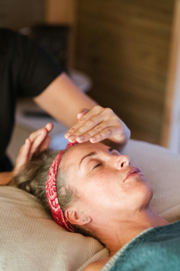 Relaxed woman getting alternative massage